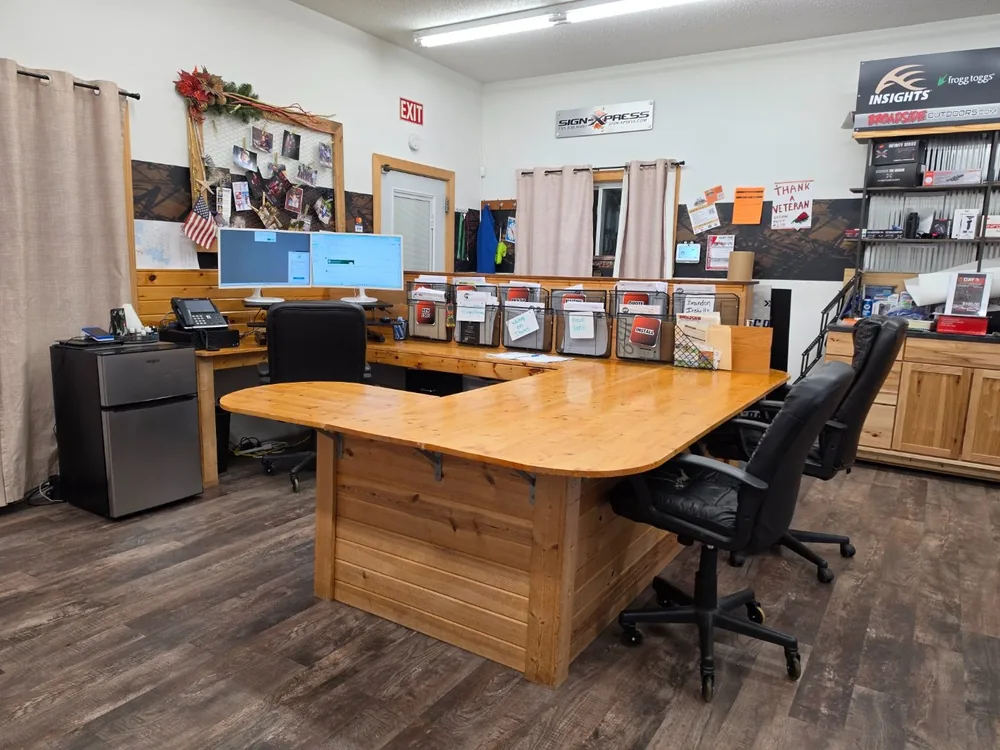 Katie’s office after xBoard: a clean, organized front desk with a clear counter and tidy workspace